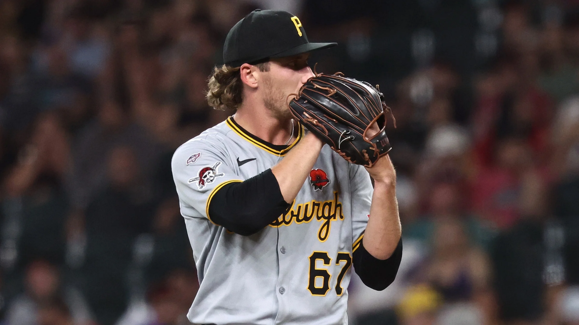 Relief pitcher Braxton Ashcraft #67 of the Pittsburgh Pirates takes the sign during the seventh inning of his MLB debut against the Arizona Diamondbacks at Chase Field on May 26, 2025 in Phoenix, Arizona. (Photo by Chris Coduto/Getty Images)