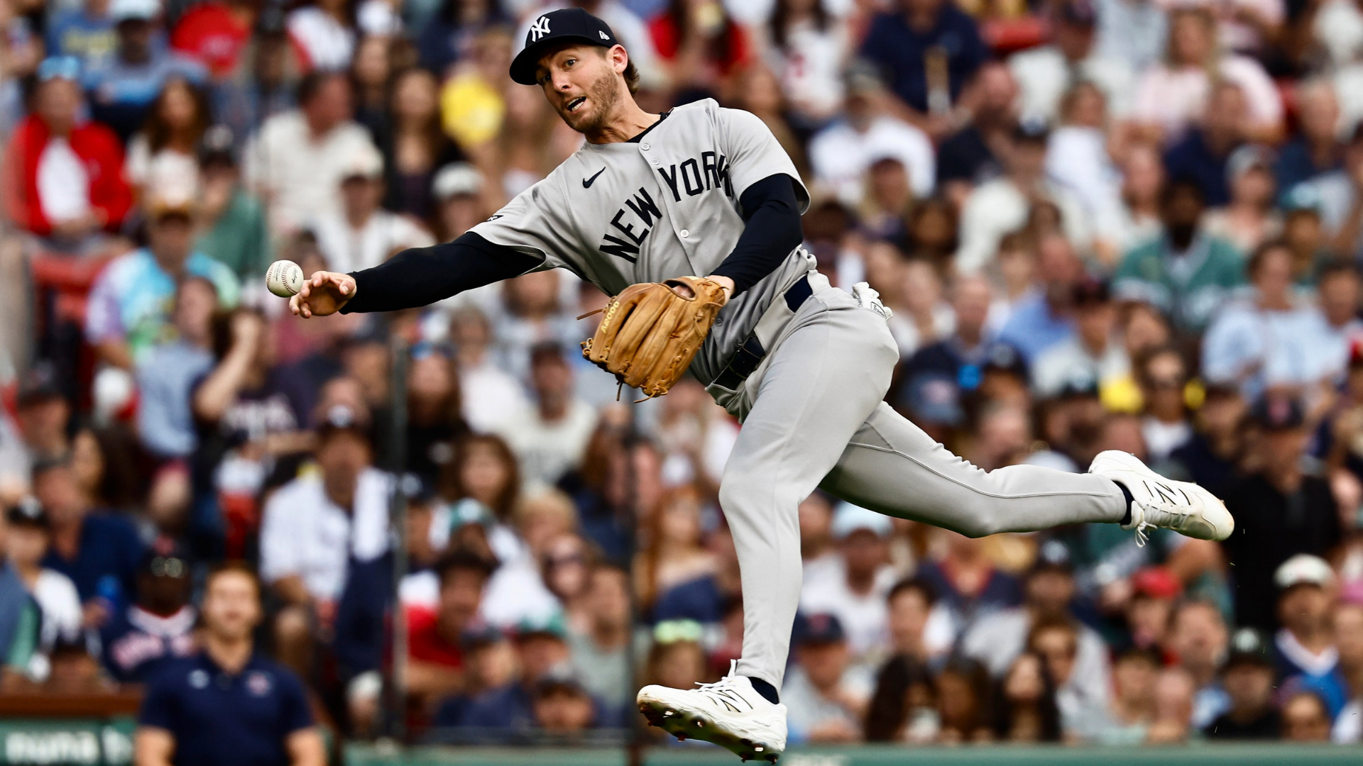 Ryan McMahon #19 of the New York Yankees attempts to throw out Nate Eaton #40 of the Boston Red Sox on an infield hit during the fourth inning at Fenway Park on September 13, 2025 in Boston, Massachusetts. (Photo By Winslow Townson/Getty Images)