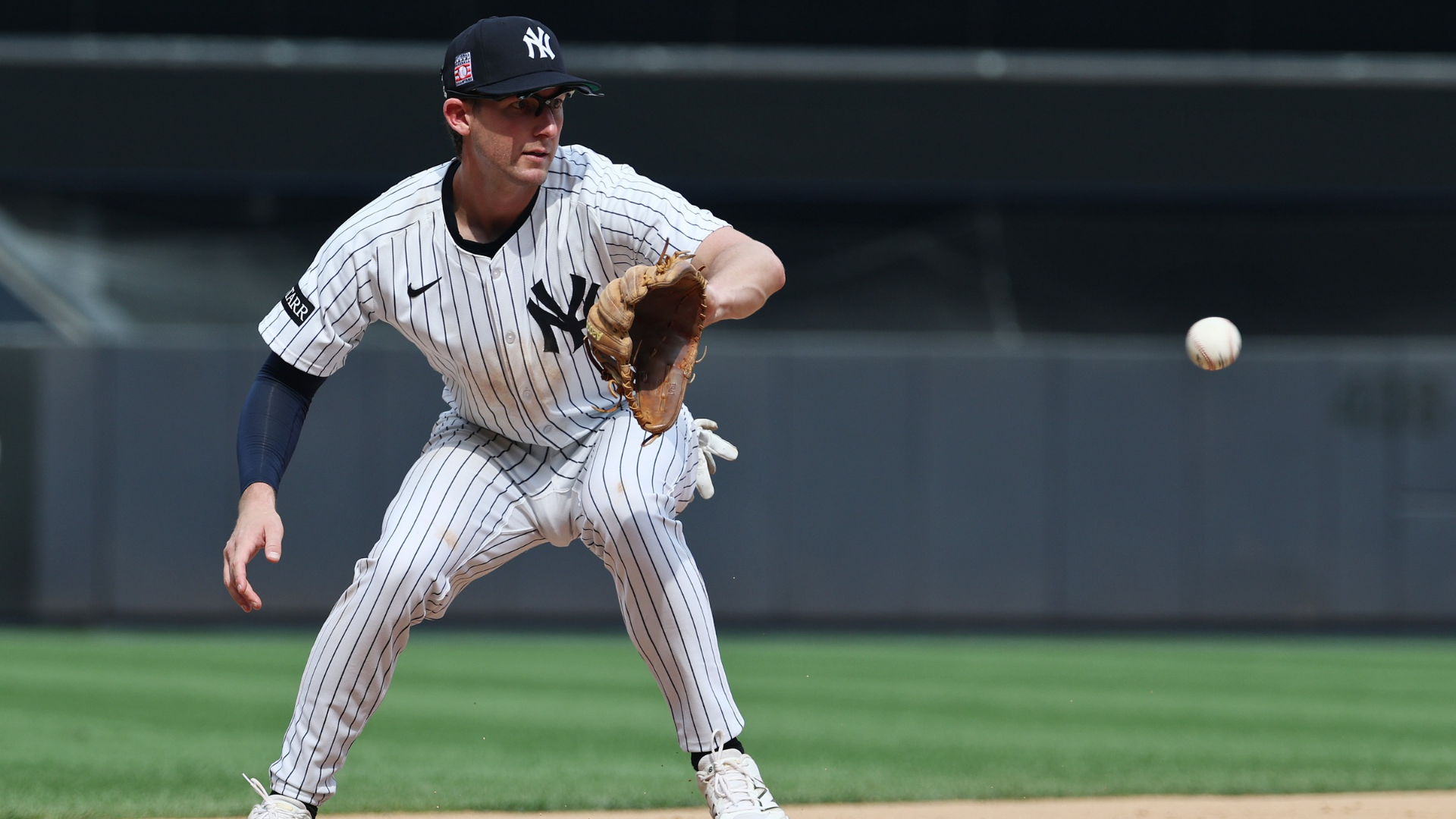 Ryan McMahon #19 of the New York Yankees makes a play in his first game as a Yankee after being traded from the Colorado Rockies during their game against the Philadelphia Phillies at Yankee Stadium on July 26, 2025 in New York City. (Photo by Al Bello/Getty Images)