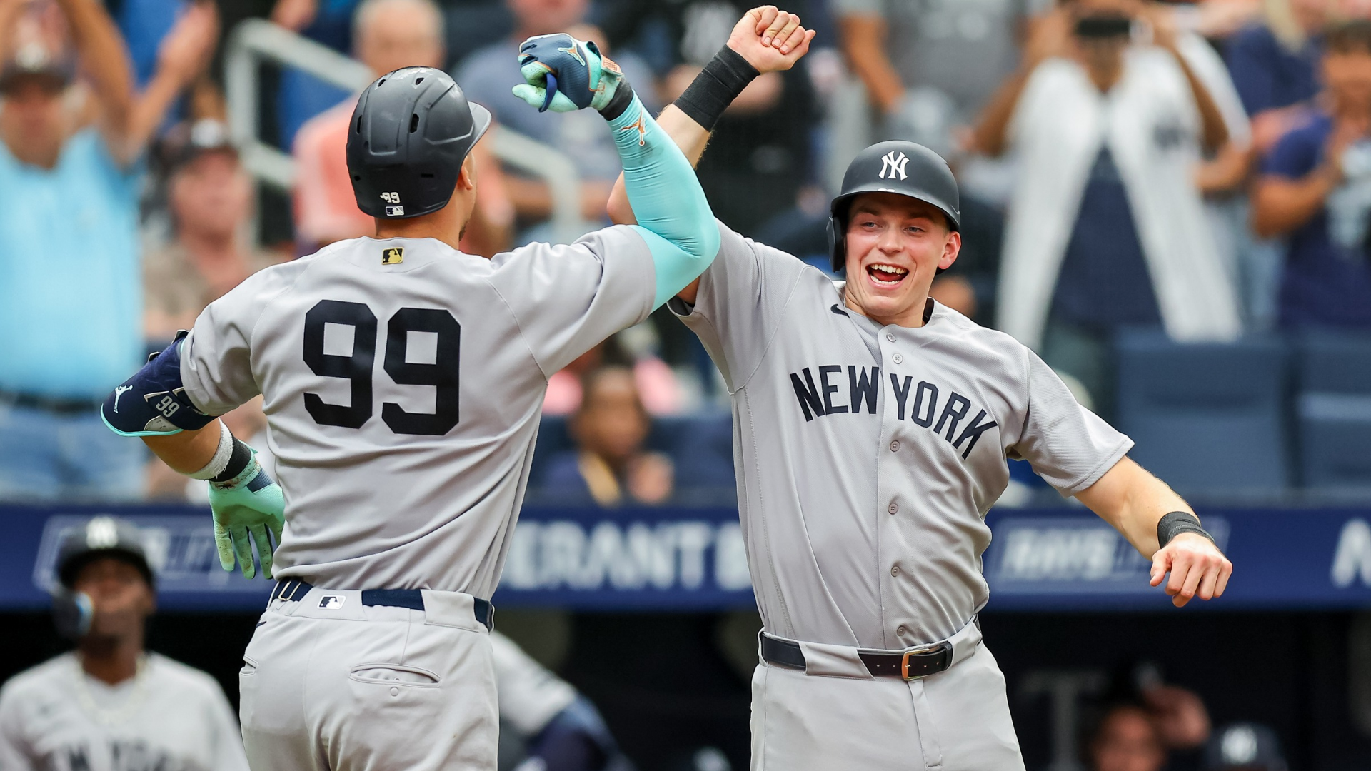 Aaron Judge #99 of the New York Yankees celebrates his home run against the Tampa Bay Rays with Ben Rice #22 during the ninth inning of a baseball game at Tropicana Field on April 12, 2026 in St. Petersburg, Florida. (Photo by Mike Carlson/Getty Images)