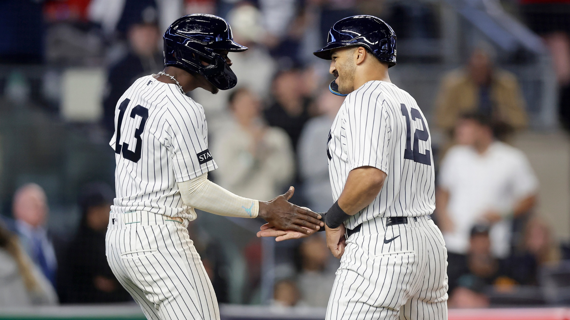 Trent Grisham #12 of the New York Yankees celebrates his game-tying, two-run home run with Jazz Chisholm Jr. #13 in the ninth inning against the Los Angeles Angels at Yankee Stadium on April 13, 2026 in New York City. (Photo by Jim McIsaac/Getty Images)