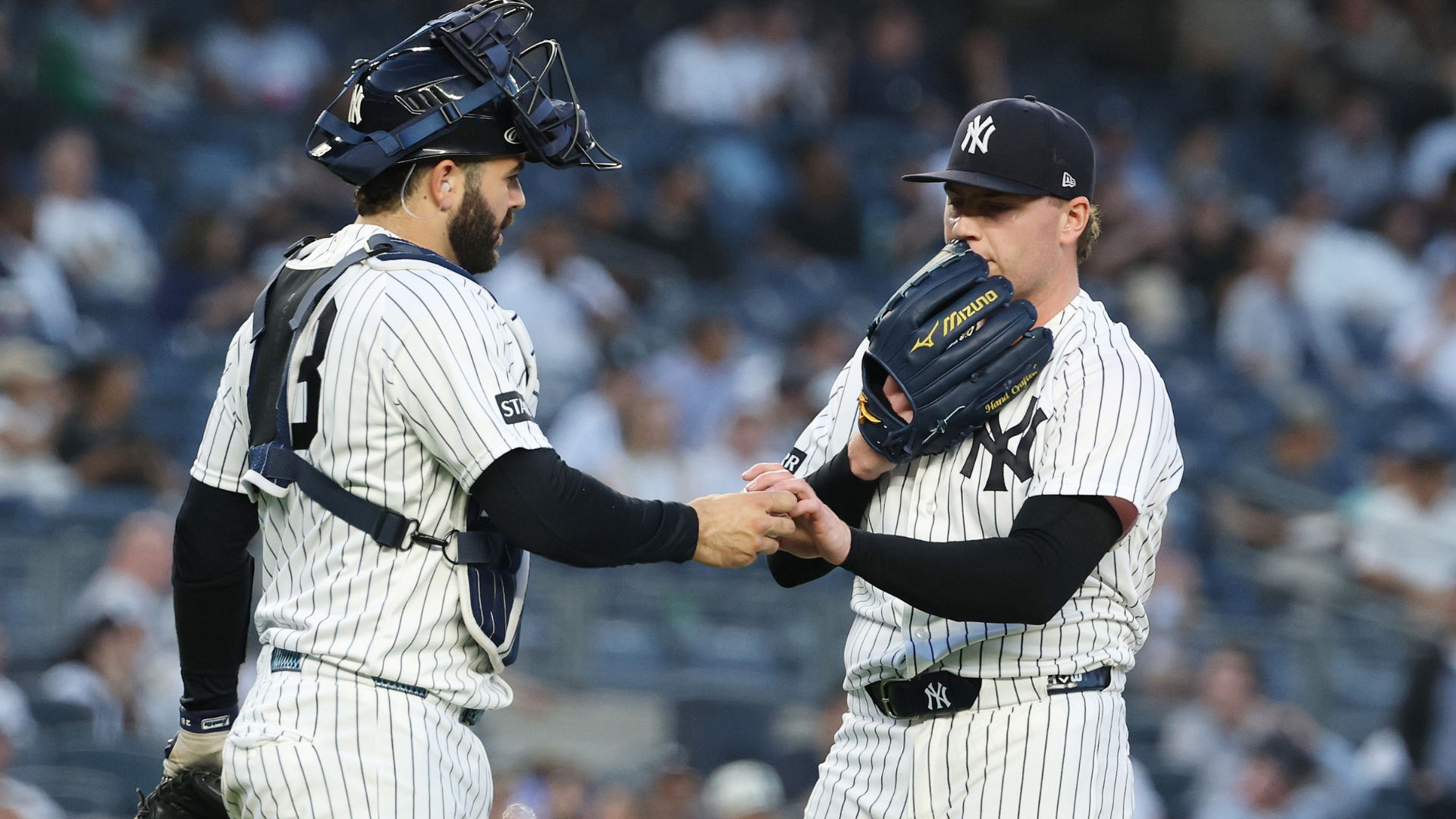 Ryan Weathers #40 and Austin Wells #28 of the New York Yankees talk after Weathers gave up three home runs in a row in the first inning against the Los Angeles Angels during their game at Yankee Stadium on April 14, 2026 in New York City. (Photo by Al Bello/Getty Images)