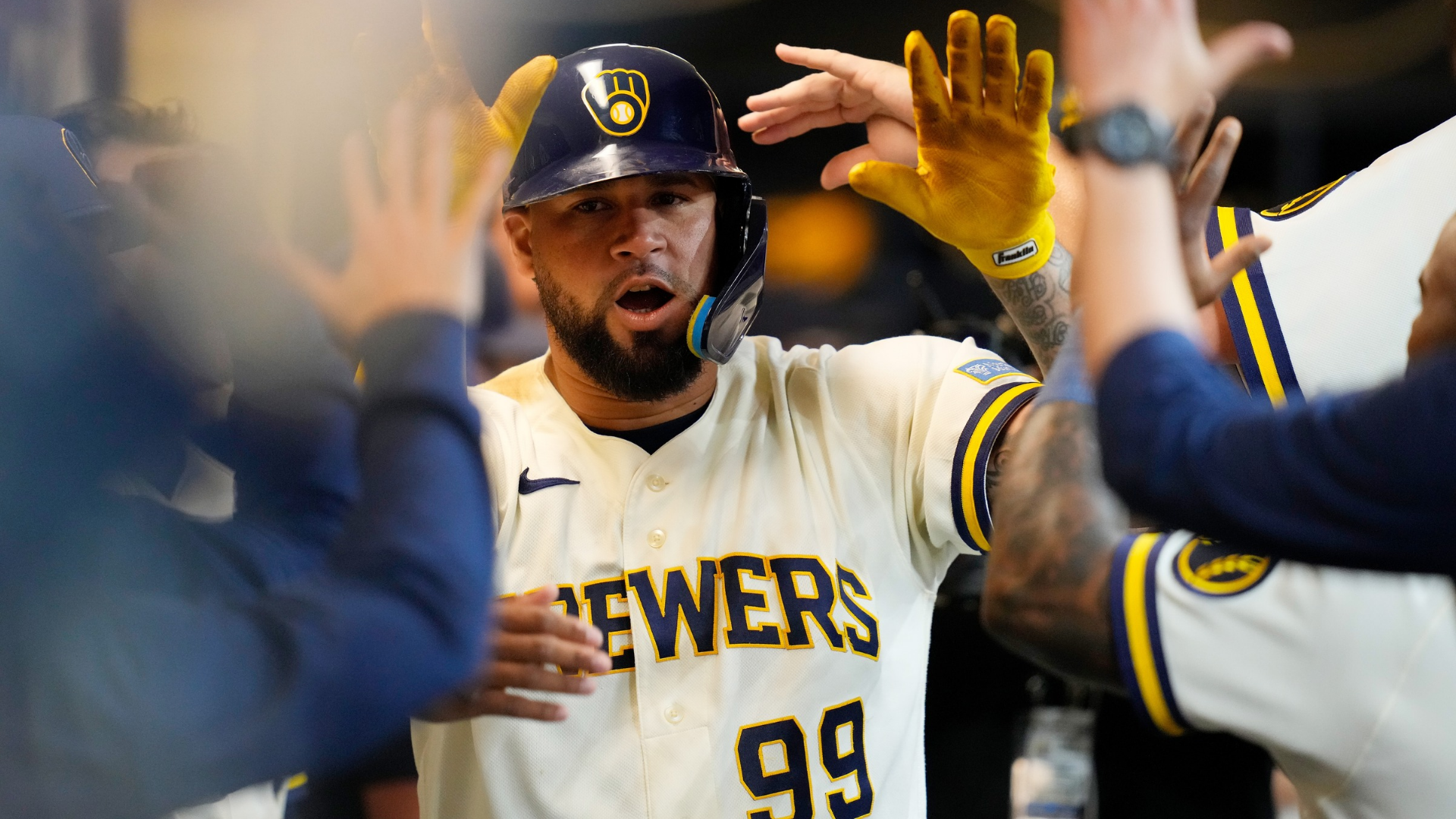 Gary Sánchez #99 of the Milwaukee Brewers is congratulated after hitting a solo home run in the sixth inning against the Tampa Bay Rays at American Family Field on March 31, 2026 in Milwaukee, Wisconsin. (Photo by John Fisher/Getty Images)