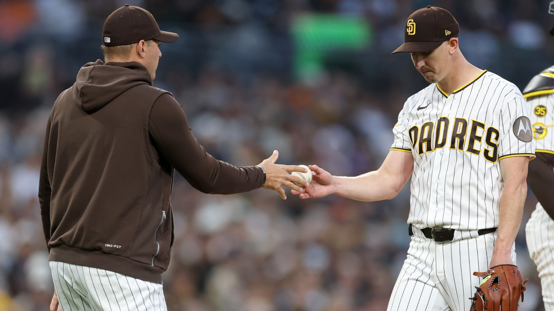 Manager Craig Stammen #14 of the San Diego Padres takes out Walker Buehler #10 in the sixth inning against the Seattle Mariners at Petco Park on April 16, 2026 in San Diego, California. (Photo by Sean M. Haffey/Getty Images)