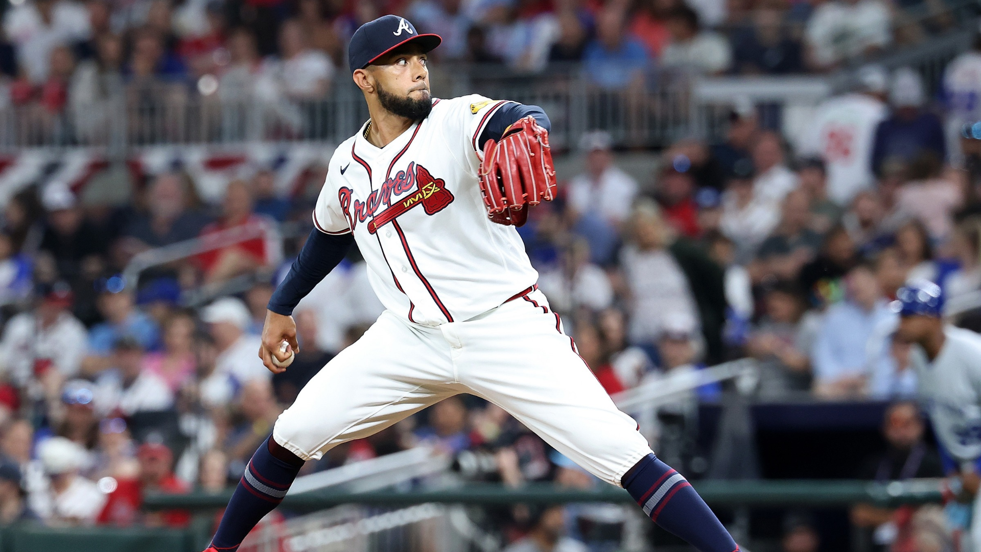 Robert Suarez #75 of the Atlanta Braves pitches in the eighth inning against the Kansas City Royals during the eighth inning of the home opener at Truist Park on March 27, 2026 in Atlanta, Georgia. (Photo by Kevin C. Cox/Getty Images)