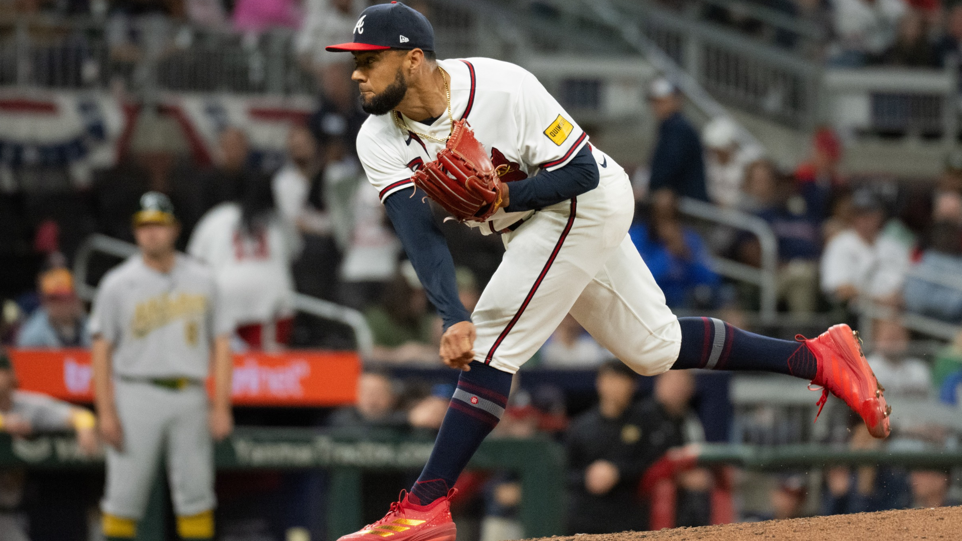 Robert Suarez #75 of the Atlanta Braves pitches in the eighth inning of a game against the Athletics at Truist Park on March 30, 2026 in Atlanta, Georgia. (Photo by Edward M. Pio Roda/Getty Images)