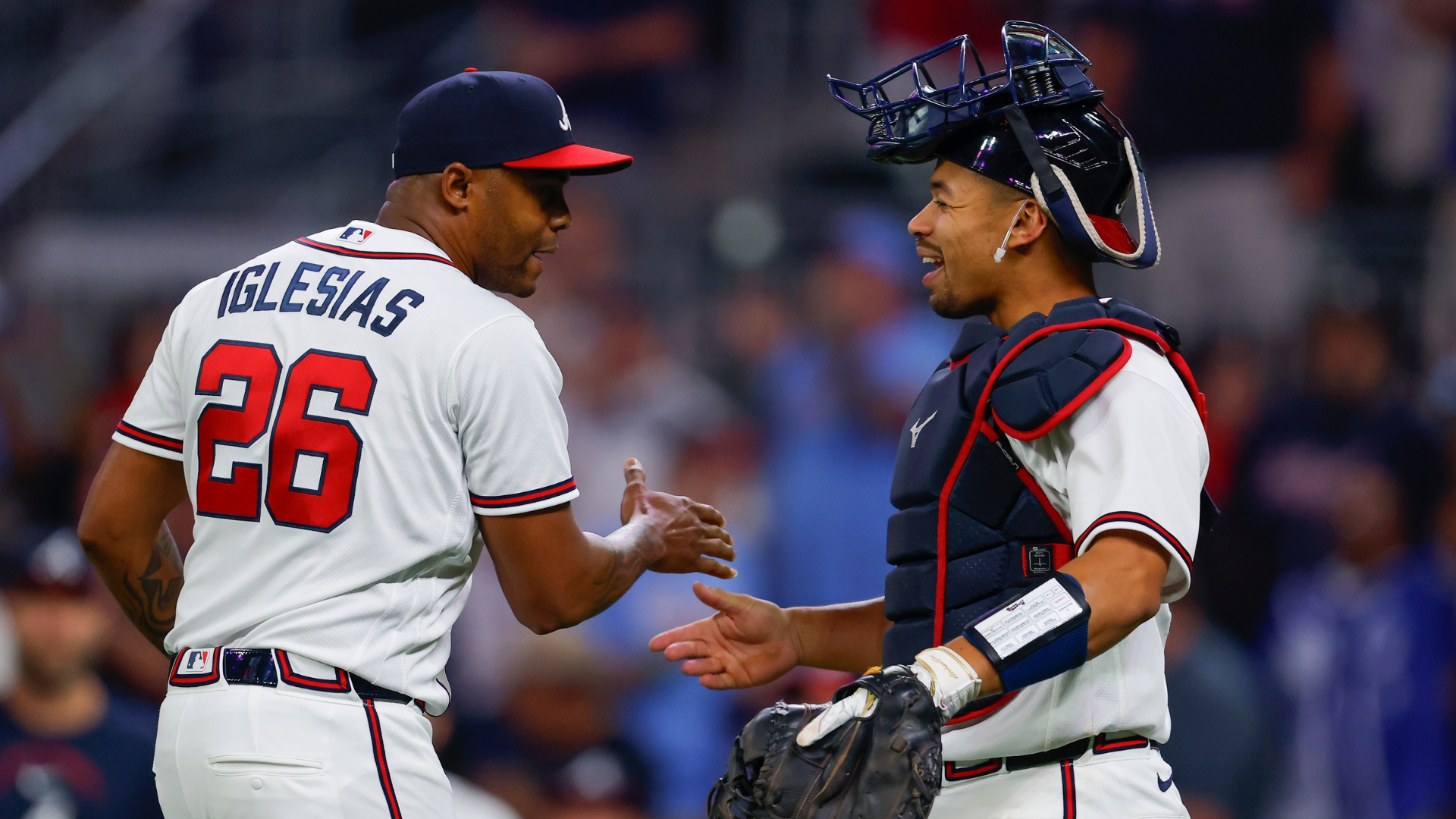 Raisel Iglesias #26 of the Atlanta Braves reacts with Drake Baldwin #30 following the 6-5 victory over the Miami Marlins at Truist Park on April 14, 2026 in Atlanta, Georgia. (Photo by Todd Kirkland/Getty Images)