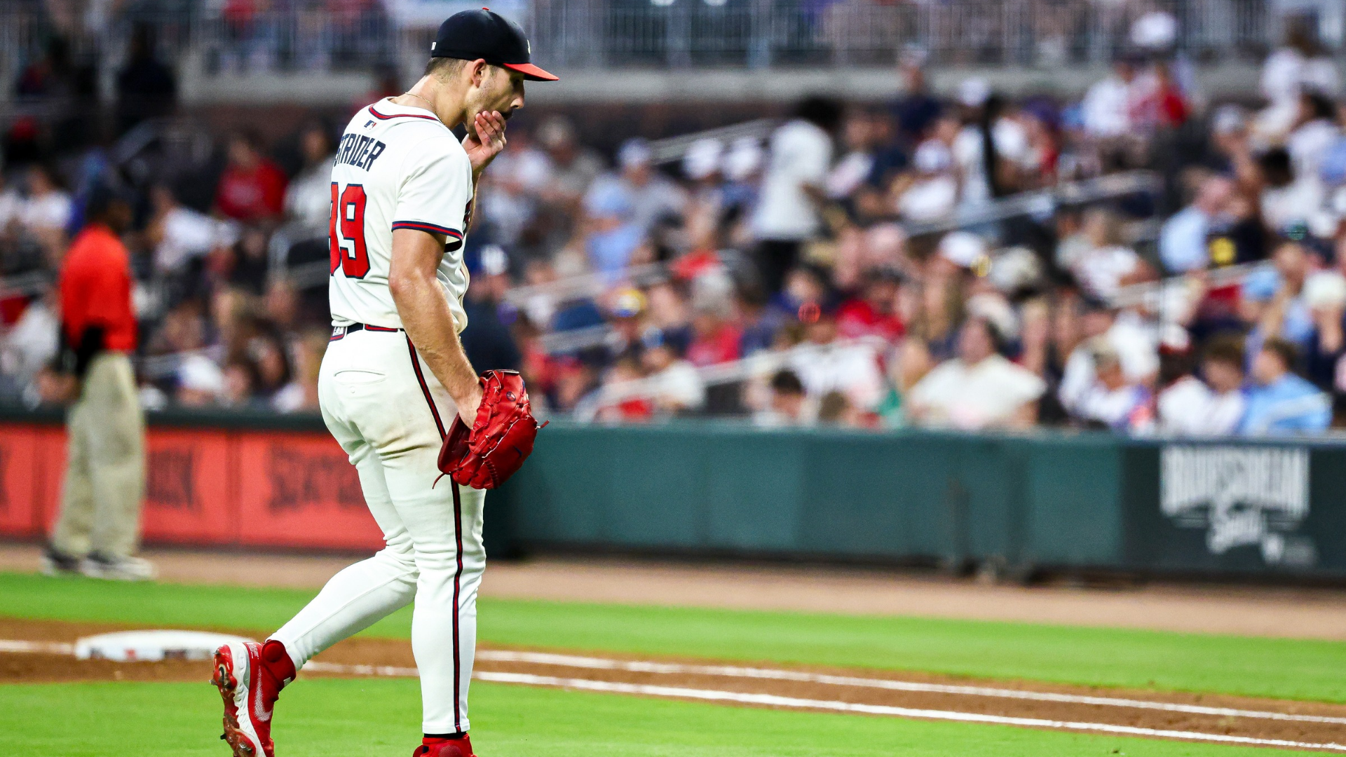 Spencer Strider #99 of the Atlanta Braves walks off the field after giving up a two-run home run to Blake Perkins #16 of the Milwaukee Brewers during the fourth inning at Truist Park on August 6, 2025 in Atlanta, Georgia. Strider gave up five runs over 4.2 innings. (Photo by Casey Sykes/Getty Images)