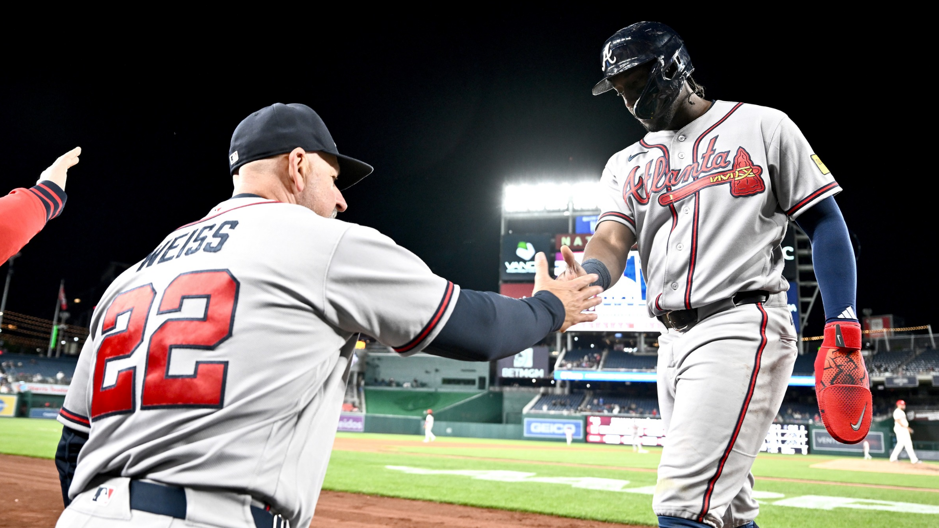 Jorge Mateo #2 of the Atlanta Braves celebrates with manager Walt Weiss #22 after scoring in the ninth inning against the Washington Nationals at Nationals Park on April 20, 2026 in Washington, DC. (Photo by Greg Fiume/Getty Images)
