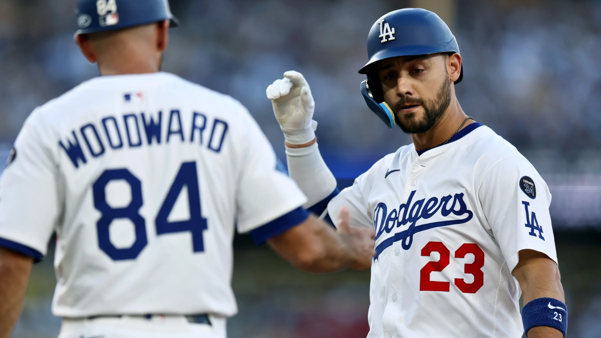 Michael Conforto #23 of the Los Angeles Dodgers celebrates his two run single with Chris Woodward #84, to take a 4-0 lead over the Chicago White Sox, during the first inning at Dodger Stadium on July 01, 2025 in Los Angeles, California. (Photo by Harry How/Getty Images)