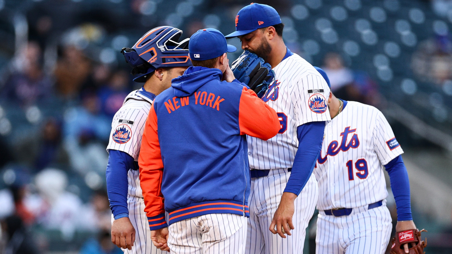 Manager Carlos Mendoza of the New York Mets meets with Sean Manaea #59 and Francisco Alvarez #4 of the New York Mets at the mound in the eighth inning against the Arizona Diamondbacks at Citi Field on April 08, 2026 in New York City. (Photo by Evan Bernstein/Getty Images)