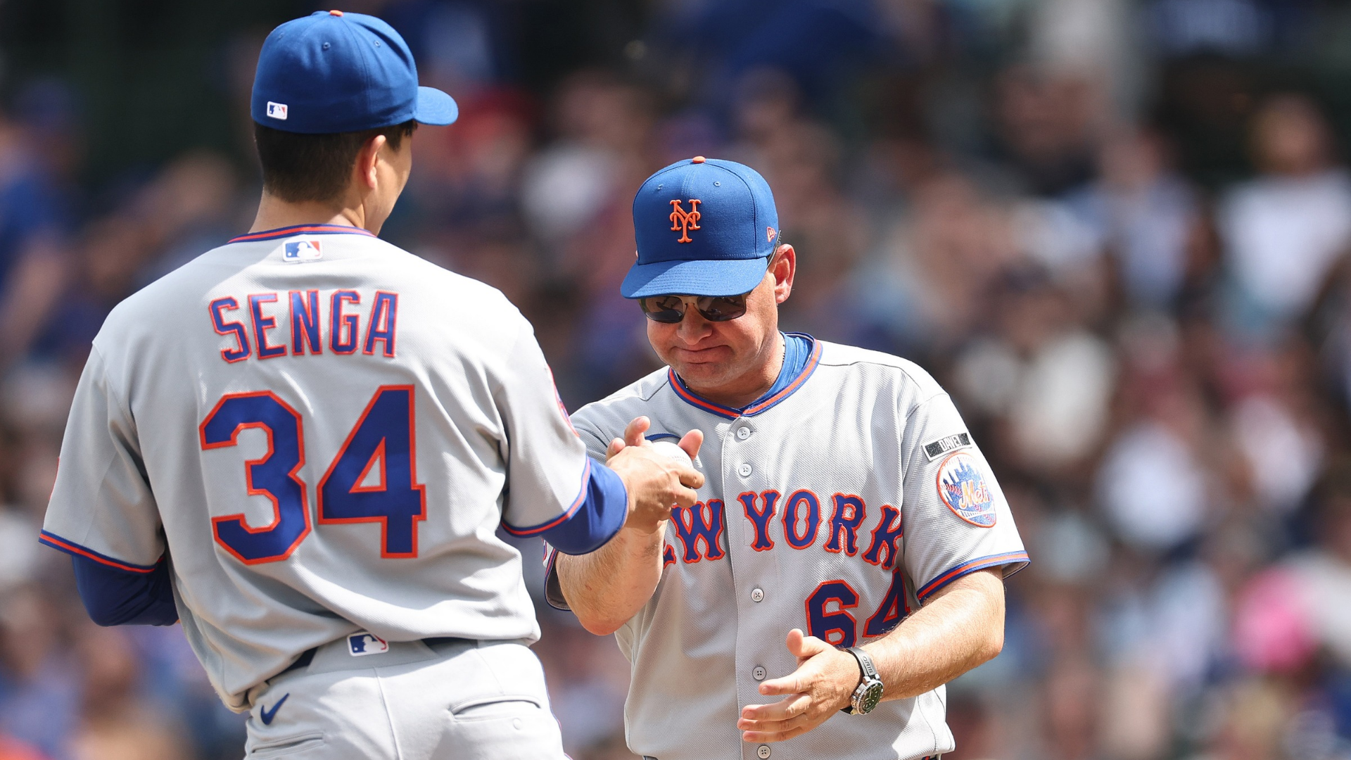 Manager Carlos Mendoza #64 of the New York Mets removes Kodai Senga #34 from the game during the fourth inning against the Chicago Cubs at Wrigley Field on April 17, 2026 in Chicago, Illinois. (Photo by Michael Reaves/Getty Images)