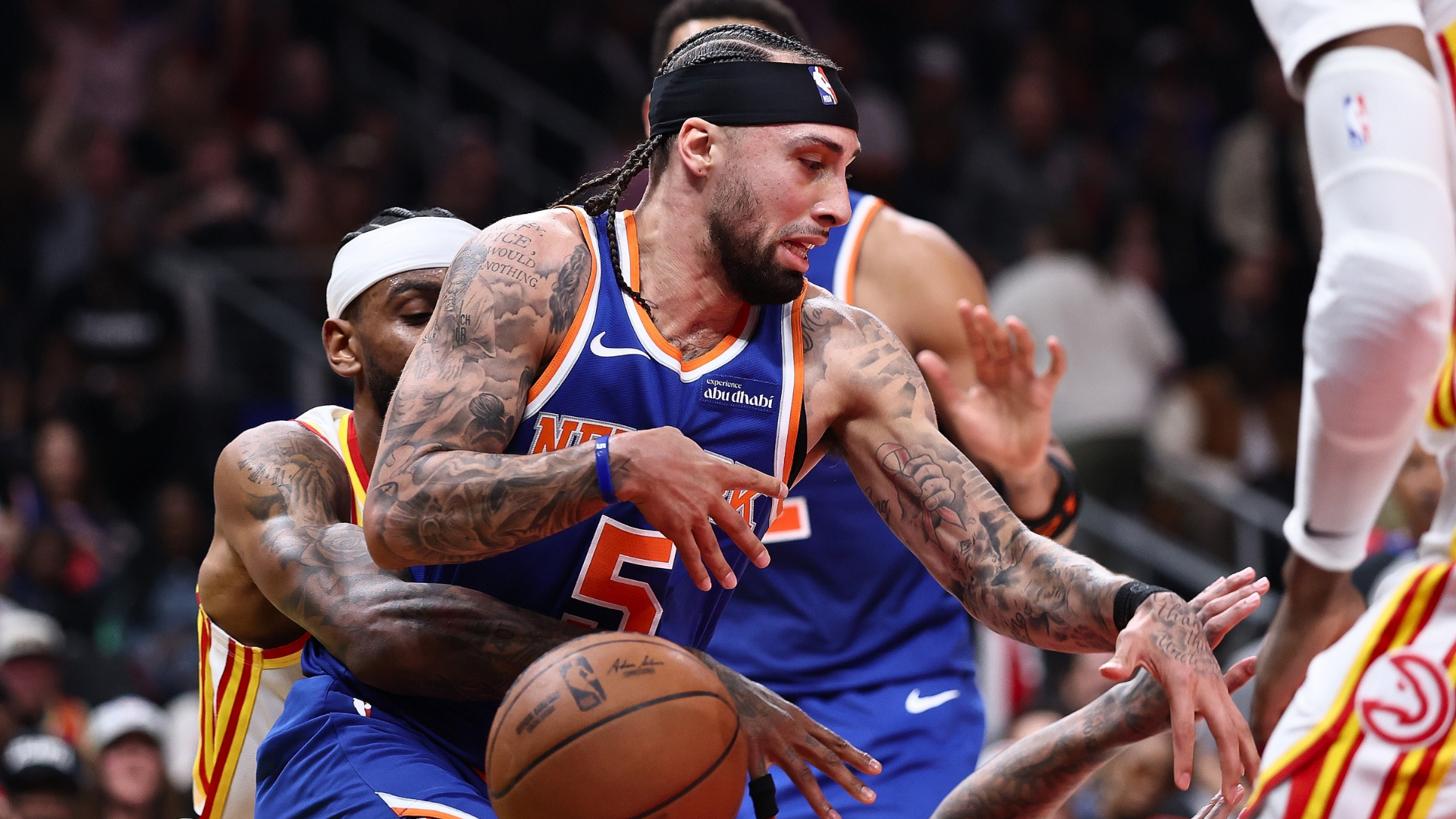 Jose Alvarado #5 of the New York Knicks has the ball knocked away by Nickeil Alexander-Walker #7 of the Atlanta Hawks during the second quarter of game four of the Eastern Conference first round playoffs at State Farm Arena on April 25, 2026 in Atlanta, Georgia. (Photo by Kevin C. Cox/Getty Images)