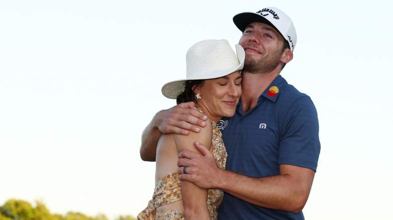 Sam Burns of the United States celebrates with his wife Caroline Campbell after defeating Davis Riley of the United States during a playoff in the final round of the Valspar Championship on the Copperhead Course at Innisbrook Resort and Golf Club on March 20, 2022 in Palm Harbor, Florida