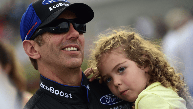 Greg Biffle holds daughter Emma on the grid at Daytona International Speedway