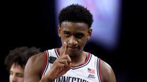 Tarris Reed Jr. #5 of the UConn Huskies reacts after defeating the Illinois Fighting Illini in the Final Four of the 2026 NCAA Men's Basketball Tournament at Lucas Oil Stadium on April 04, 2026