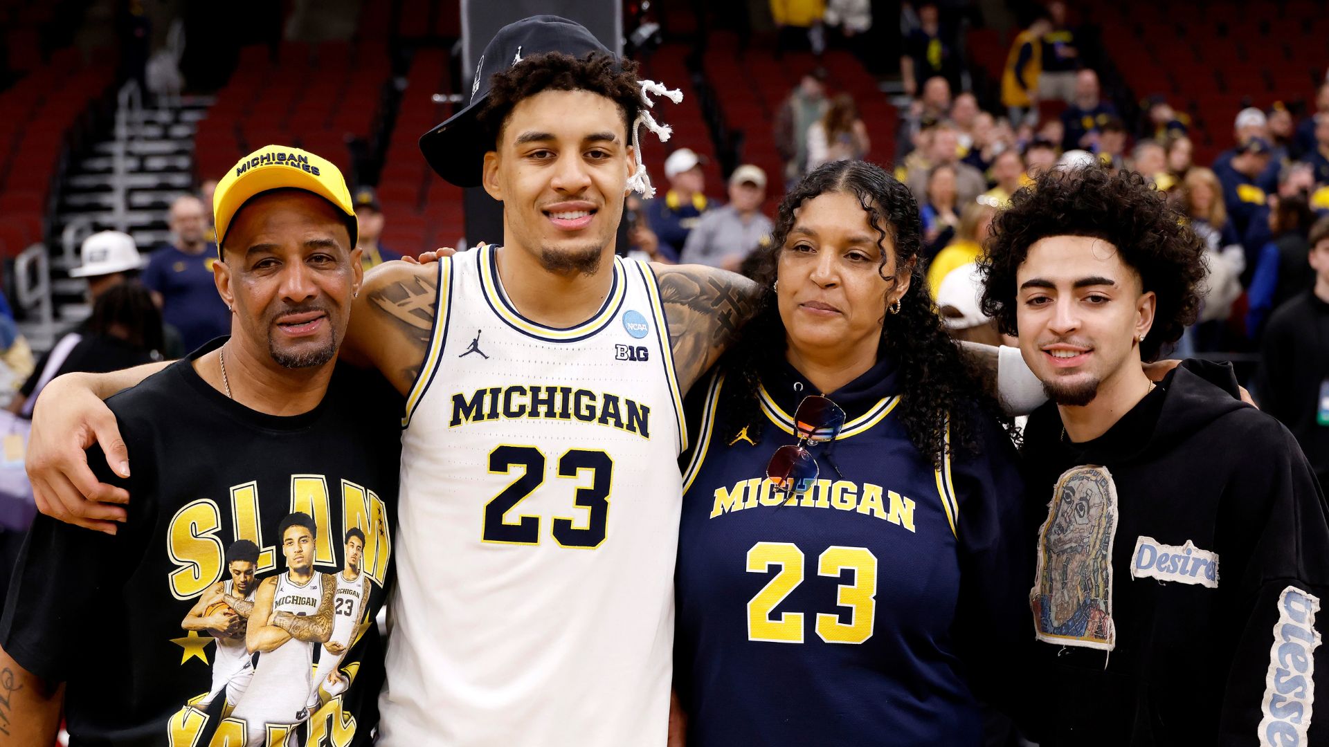 Yaxel Lendeborg #23 of the Michigan Wolverines poses with his family after the game against the Tennessee Volunteers in the Elite Eight of the 2026 NCAA Men's Basketball Tournament at the United Center on March 29, 2026