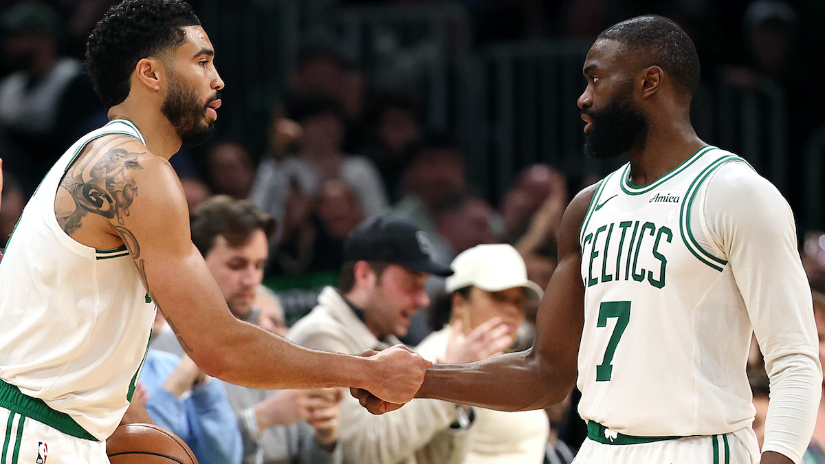 Jayson Tatum and Jaylen Brown shake hands on the court.