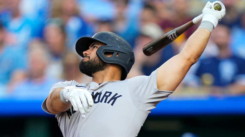 New York Yankees outfielder Jasson Dominguez follows through on a swing during a game before leaving after a hit by pitch and undergoing X-ray tests.