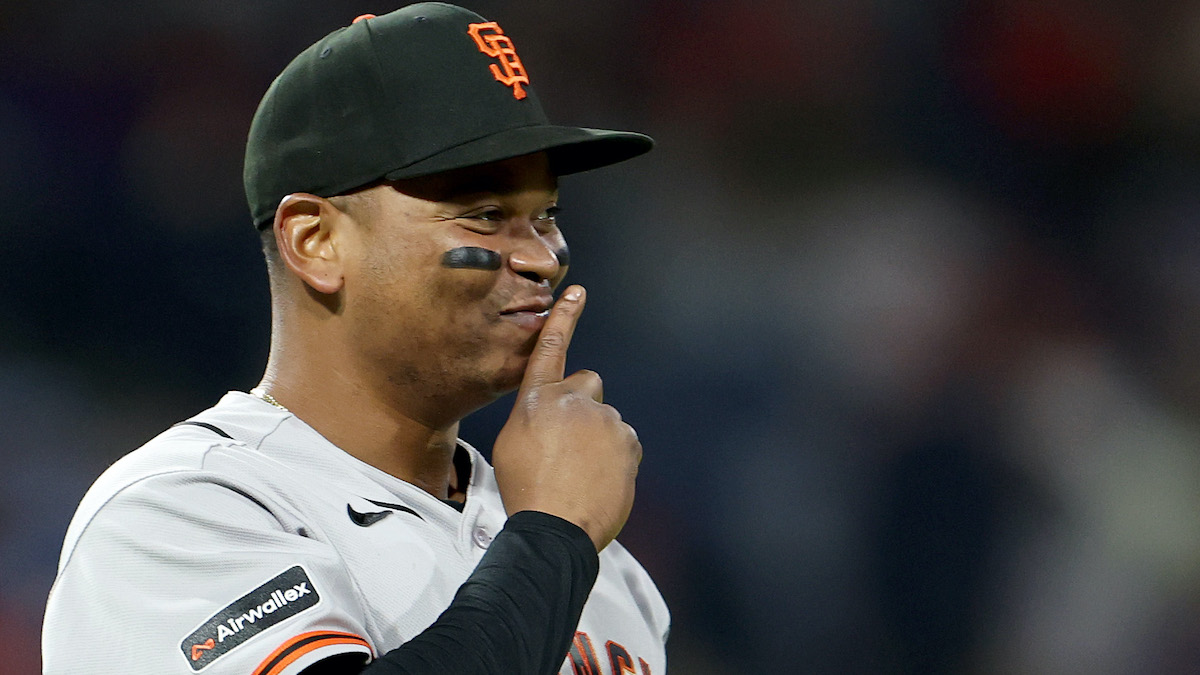 Rafael Devers of the San Francisco Giants reacts during a game after the Red Sox trade fallout narrative grows.