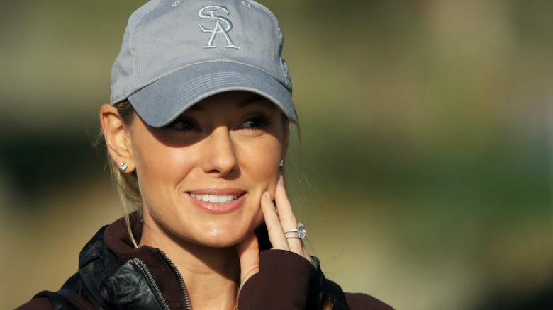 Erica Stoll, wife of Rory McIlroy, reacts at a golf tournament.