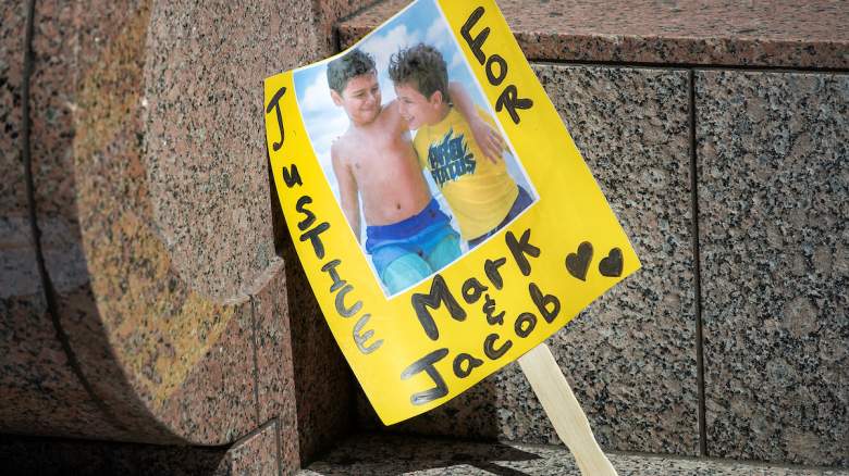 A sign calls for justice for Mark and Jacob Iksander.