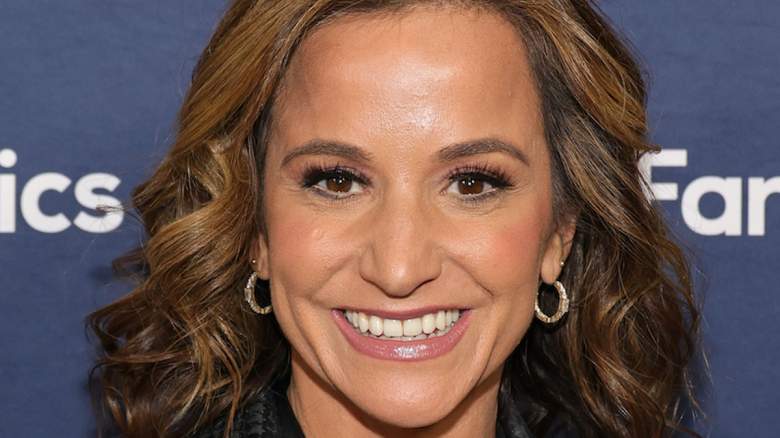 Dianna Russini smiles at an event as new attention surrounds a Spotify playlist reportedly linked to Mike Vrabel.