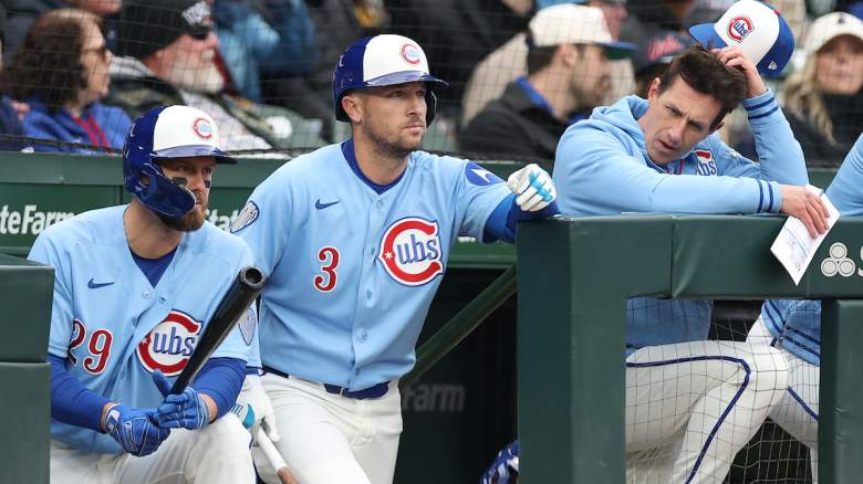 Alex Bregman anad manager Crag Counsell of the Chicago Cubs look downcast in the dugout.