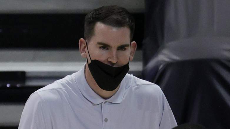 Greg St Jean coaching Luka Doncic during Mavericks game