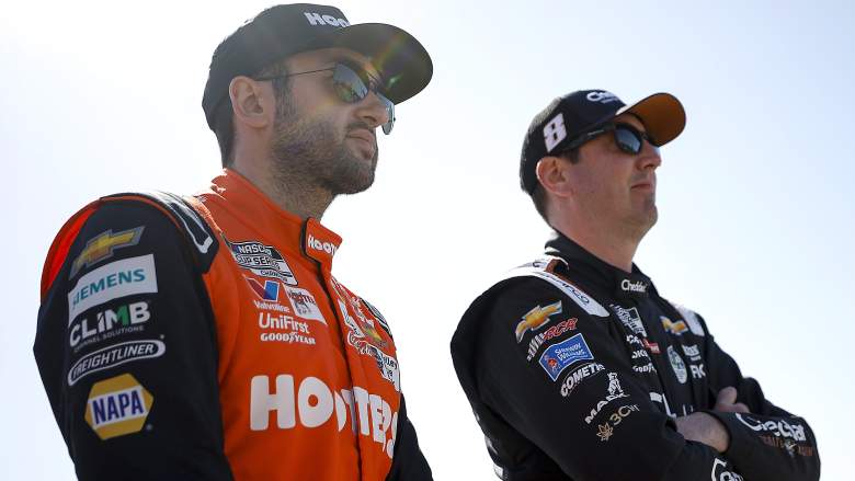 Chase Elliott and Kyle Busch stand on the grid before NASCAR Cup Series qualifying at Atlanta Motor Speedway in 2024.