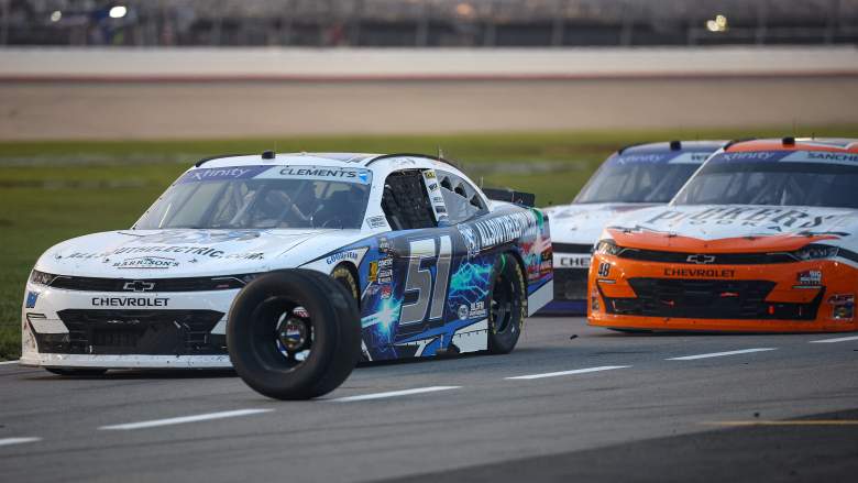 A loose tire rolls across pit road during a NASCAR Xfinity Series race at Nashville Superspeedway.