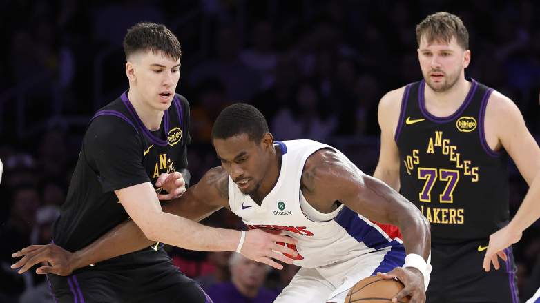 Detroit Pistons center Jalen Duren drives against the Los Angeles Lakers with Luka Doncic visible in the background.