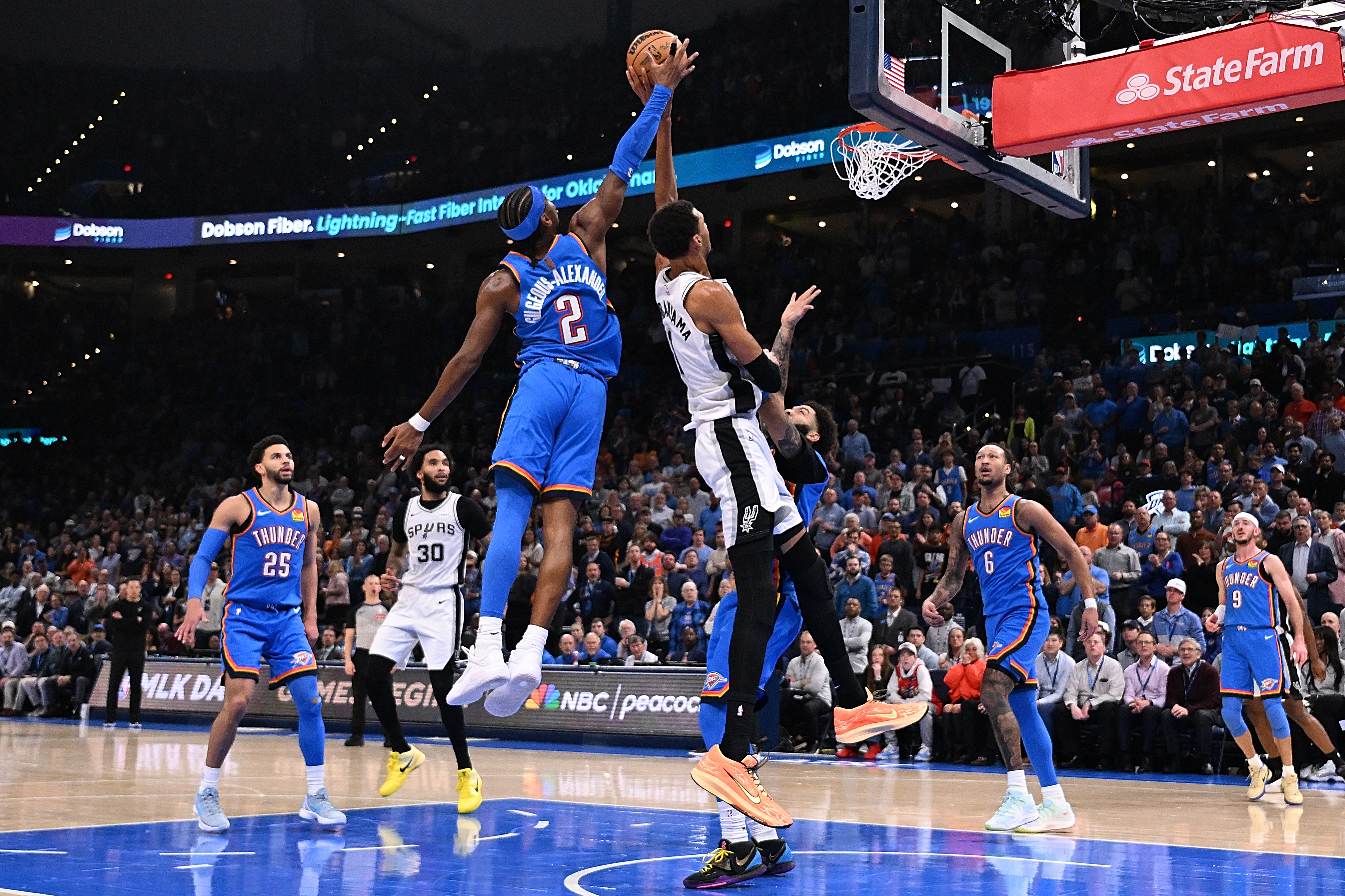 Shai Gilgeous-Alexander #2 of the Oklahoma City Thunder blocks a shot attempt by Victor Wembanyama
