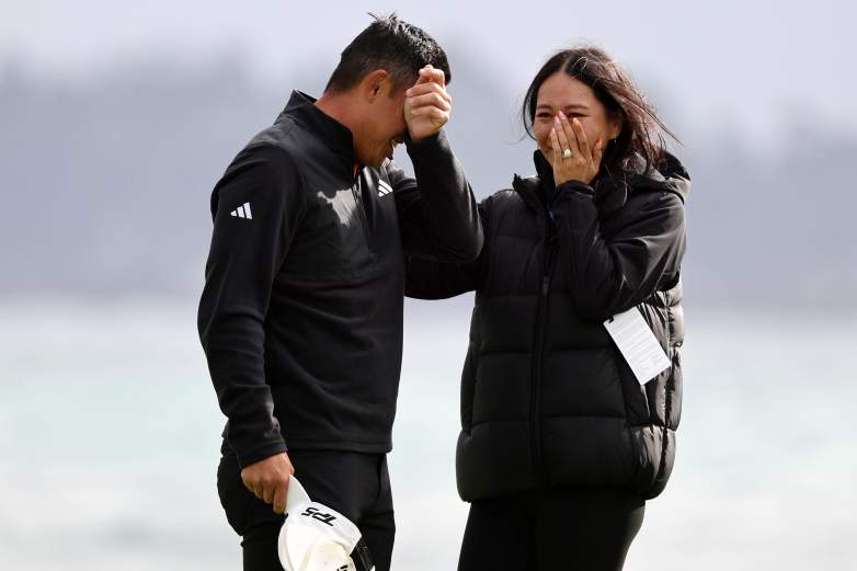 Collin Morikawa of the United States hugs his wife Katherine Zhu
