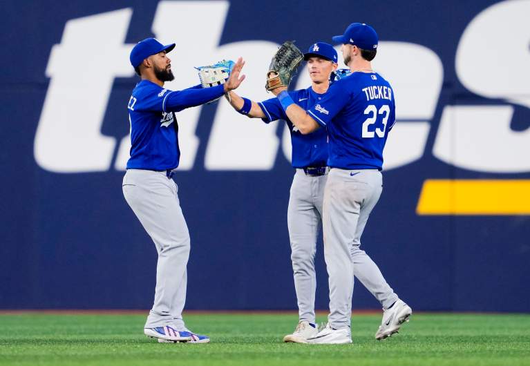 Los Angeles Dodgers outfielders Teoscar Hernandez, Alex Call, and Kyle Tucker. 