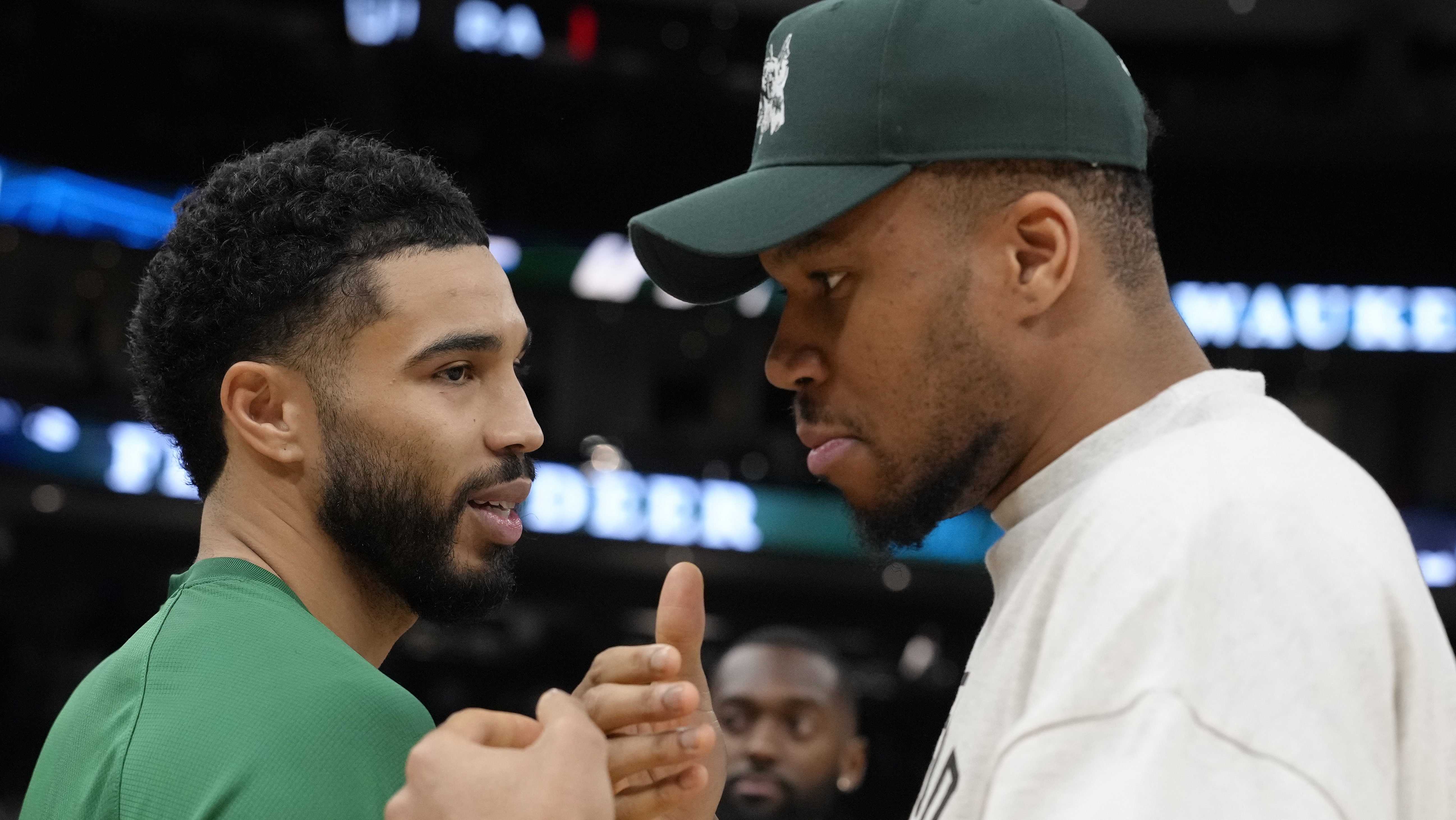 Jayson Tatum #0 of the Boston Celtics and Giannis Antetokounmpo #34 of the Milwaukee Bucks