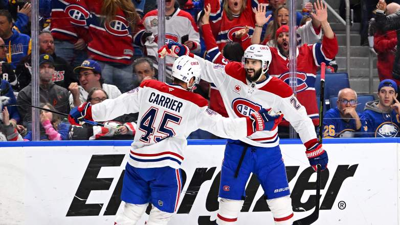 Alexandre Carrier #45 of the Montréal Canadiens celebrates a goal with Phillip Danault #24 of the Montréal Canadiens during the third period against the Buffalo Sabre in Game Two of the Second Round of the 2026 Stanley Cup Playoffs at KeyBank Center on May 08, 2026 in Buffalo, New York