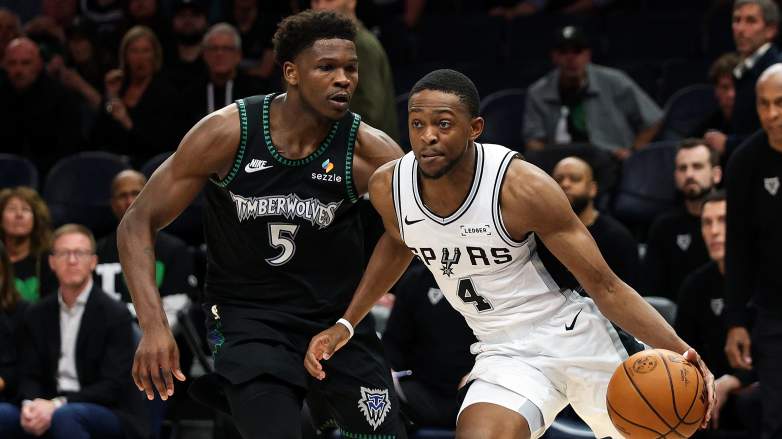 DeAaron Fox drives against Timberwolves star Anthony Edwards while playing through ankle injury