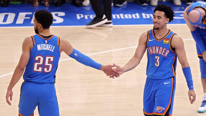 Oklahoma City Thunder guards Ajay Mitchell and Jared McCain celebrate during a playoff game against the San Antonio Spurs in the Western Conference finals