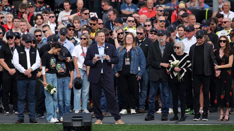 Samantha Busch, Brexton Busch, Kurt Busch, and NASCAR officials during a remembrance ceremony for Kyle Busch before the Coca-Cola 600.