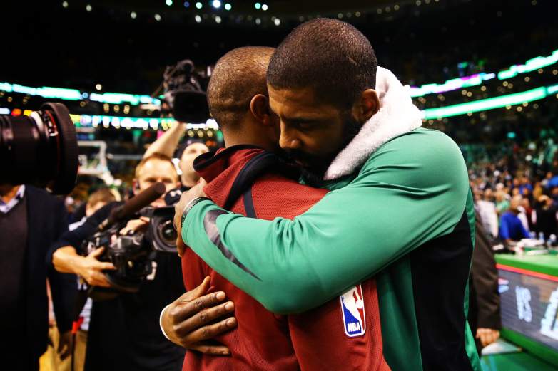 Kyrie Irving hugs Isaiah Thomas