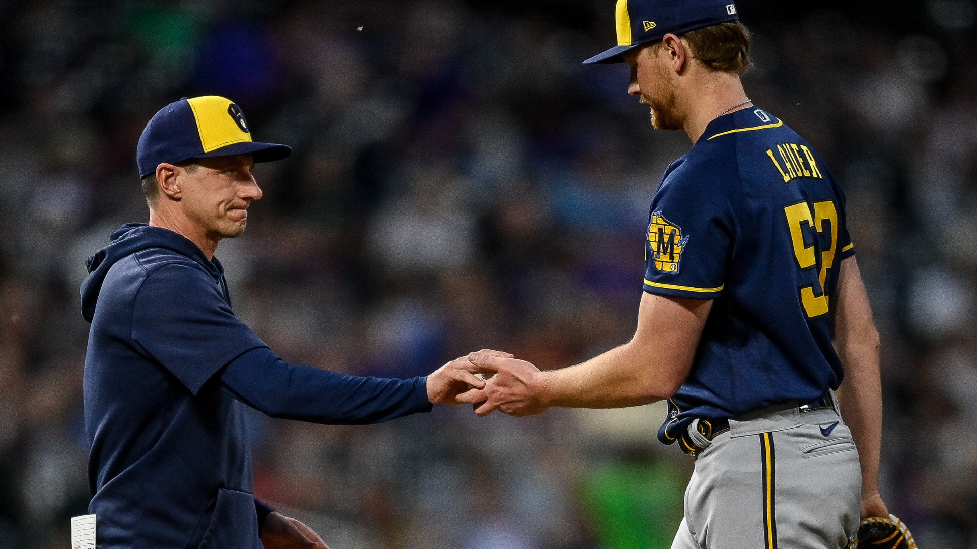 Eric Lauer #52 of the Milwaukee Brewers is taken out of the game by manager Craig Counsell #30 in the fifth inning against the Colorado Rockies at Coors Field on May 3, 2023 in Denver, Colorado. (Photo by Dustin Bradford/Getty Images)