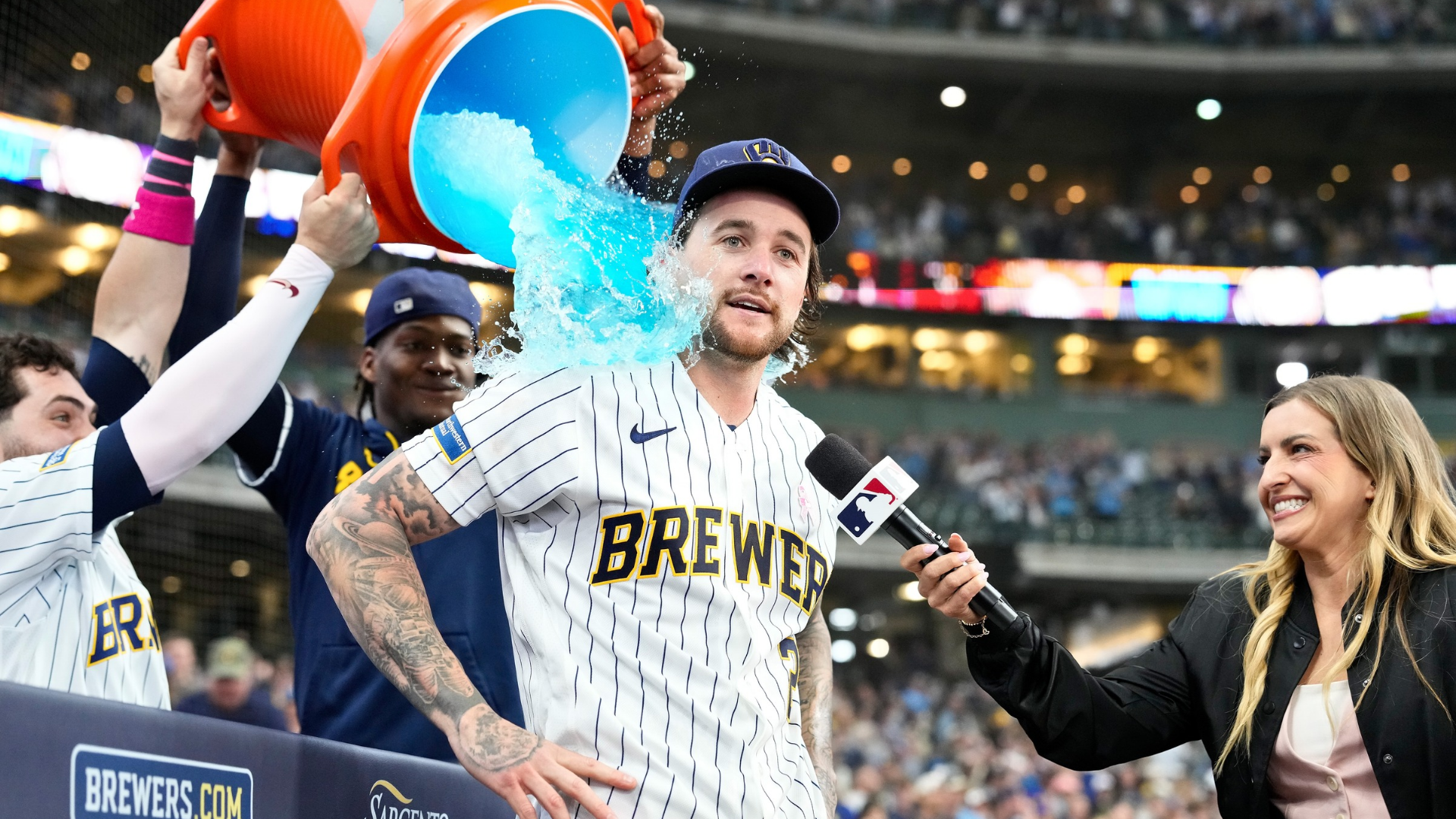 Brice Turang #2 of the Milwaukee Brewers has sports drink dumped on him after hitting a walk off home run in the ninth inning against the New York Yankees at American Family Field on May 10, 2026 in Milwaukee, Wisconsin. (Photo by John Fisher/Getty Images)