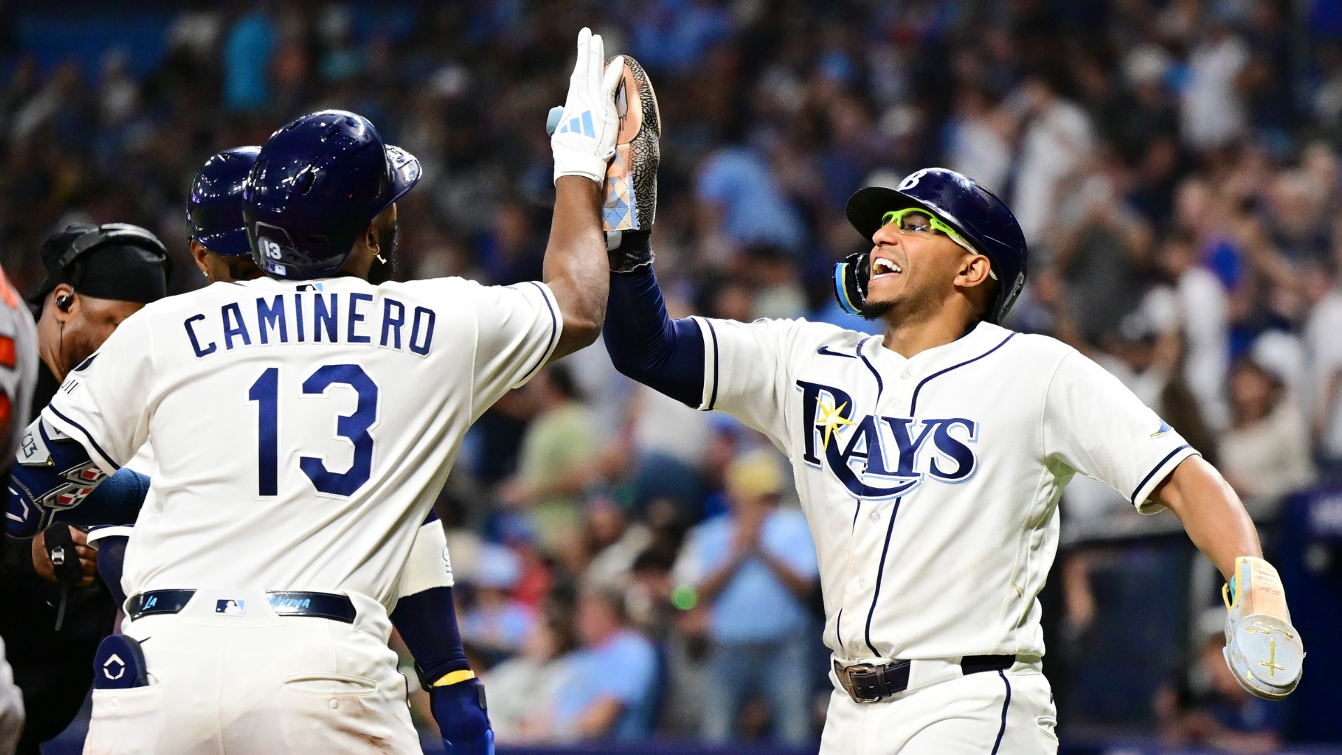 Junior Caminero #13 of the Tampa Bay Rays celebrates with teammate Richie Palacios #1 after hitting a three-run home run in the fifth inning against the Baltimore Orioles at Tropicana Field on May 18, 2026 in St Petersburg, Florida. (Photo by Julio Aguilar/Getty Images)