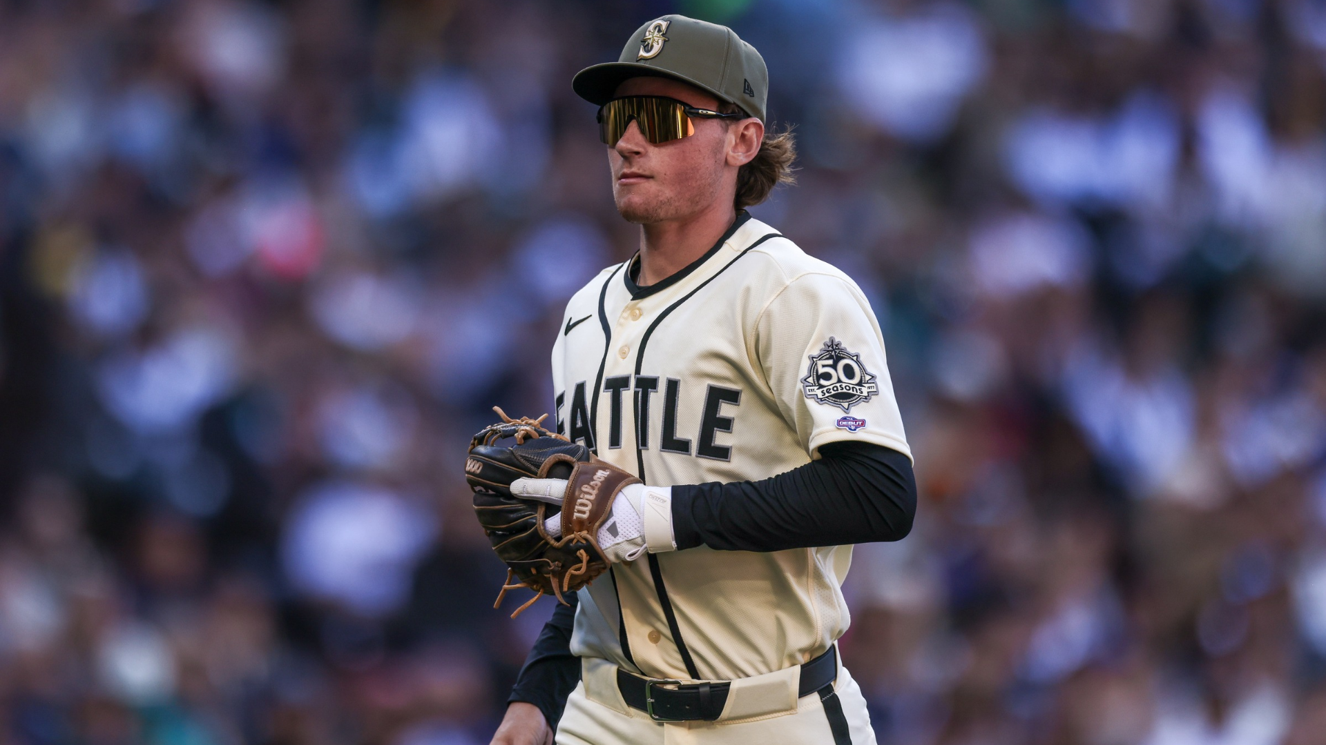 Top prospect Colt Emerson #4 of the Seattle Mariners heads to the dug out after making a catch during the fifth inning of his MLB debut against the San Diego Padres at T-Mobile Park on May 17, 2026 in Seattle, Washington. (Photo by Jack Compton/Getty Images)