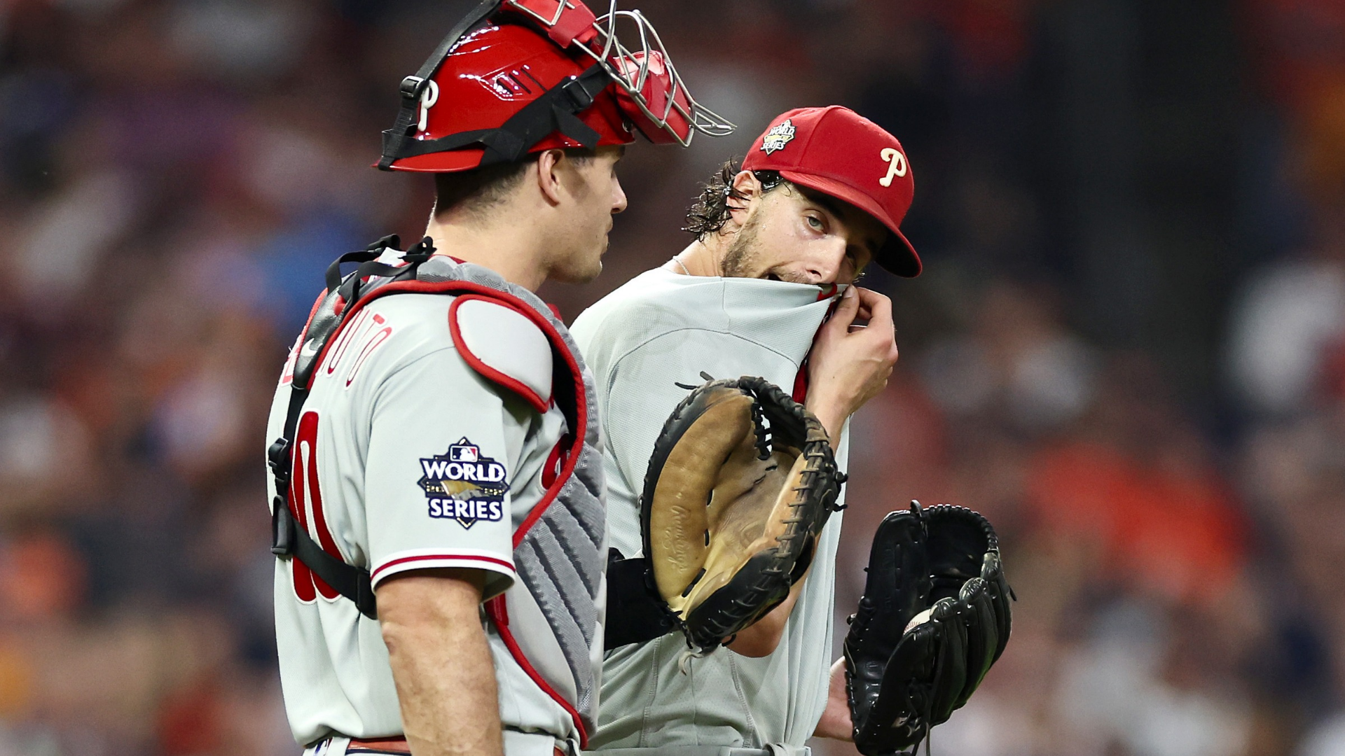 Aaron Nola #27 of the Philadelphia Phillies reacts alongside catcher J.T. Realmuto #10 during a mound conference in the second inning in Game One of the 2022 World Series against the Houston Astros at Minute Maid Park on October 28, 2022 in Houston, Texas. (Photo by Sean M. Haffey/Getty Images)