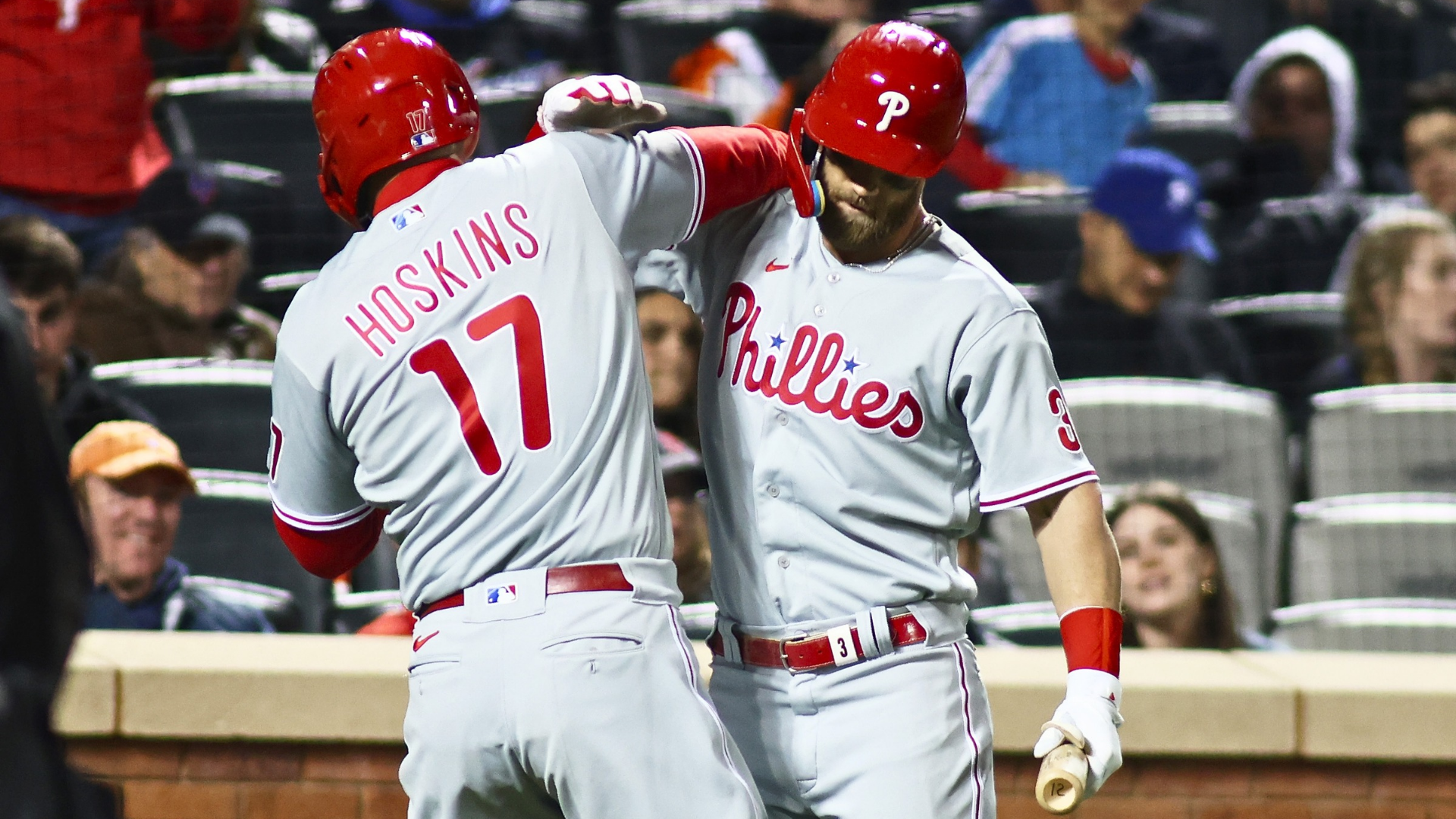Rhys Hoskins #17 of the Philadelphia Phillies celebrates with Bryce Harper #3 after hitting a solo home run in the eighth inning against the New York Mets at Citi Field on April 30, 2022 in New York City. (Photo by Mike Stobe/Getty Images)