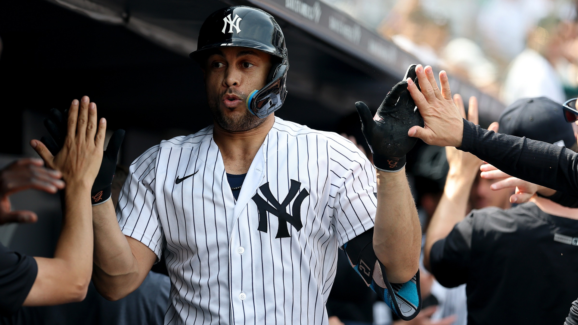 Giancarlo Stanton #27 of the New York Yankees celebrates in the dugout after hitting a two run home run in the third inning against the Los Angeles Angels at Yankee Stadium on April 16, 2026 in The Bronx borough of New York City. (Photo by Elsa/Getty Images)