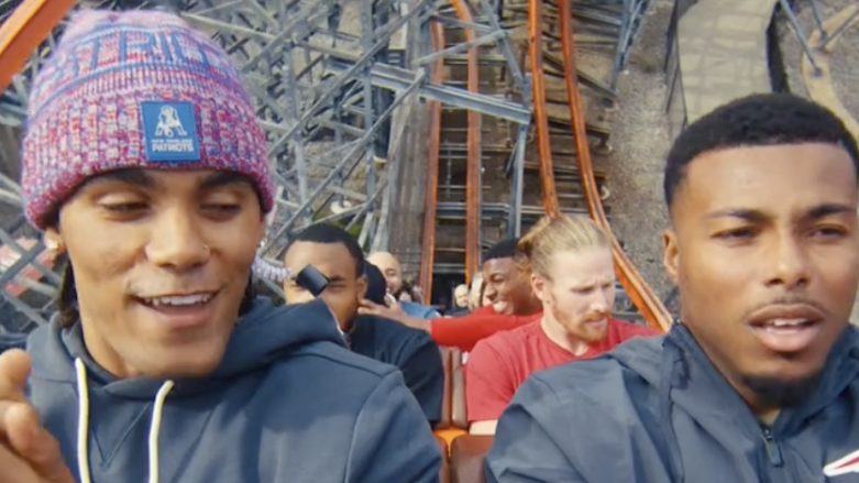 Christian Gonzalez riding roller coaster during Patriots schedule release video
