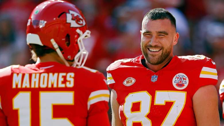 Travis Kelce #87 and Patrick Mahomes #15 of the Kansas City Chiefs talk before the game against the Los Angeles Chargers at GEHA Field at Arrowhead Stadium on October 22, 2023 in Kansas City, Missouri